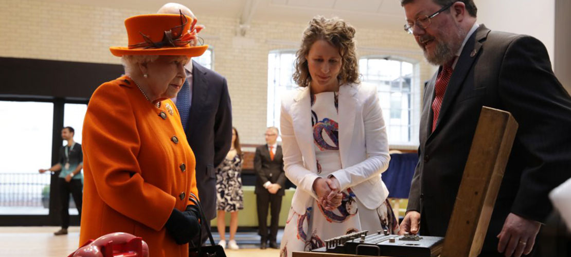HM Queen Elizabeth with enigma machine