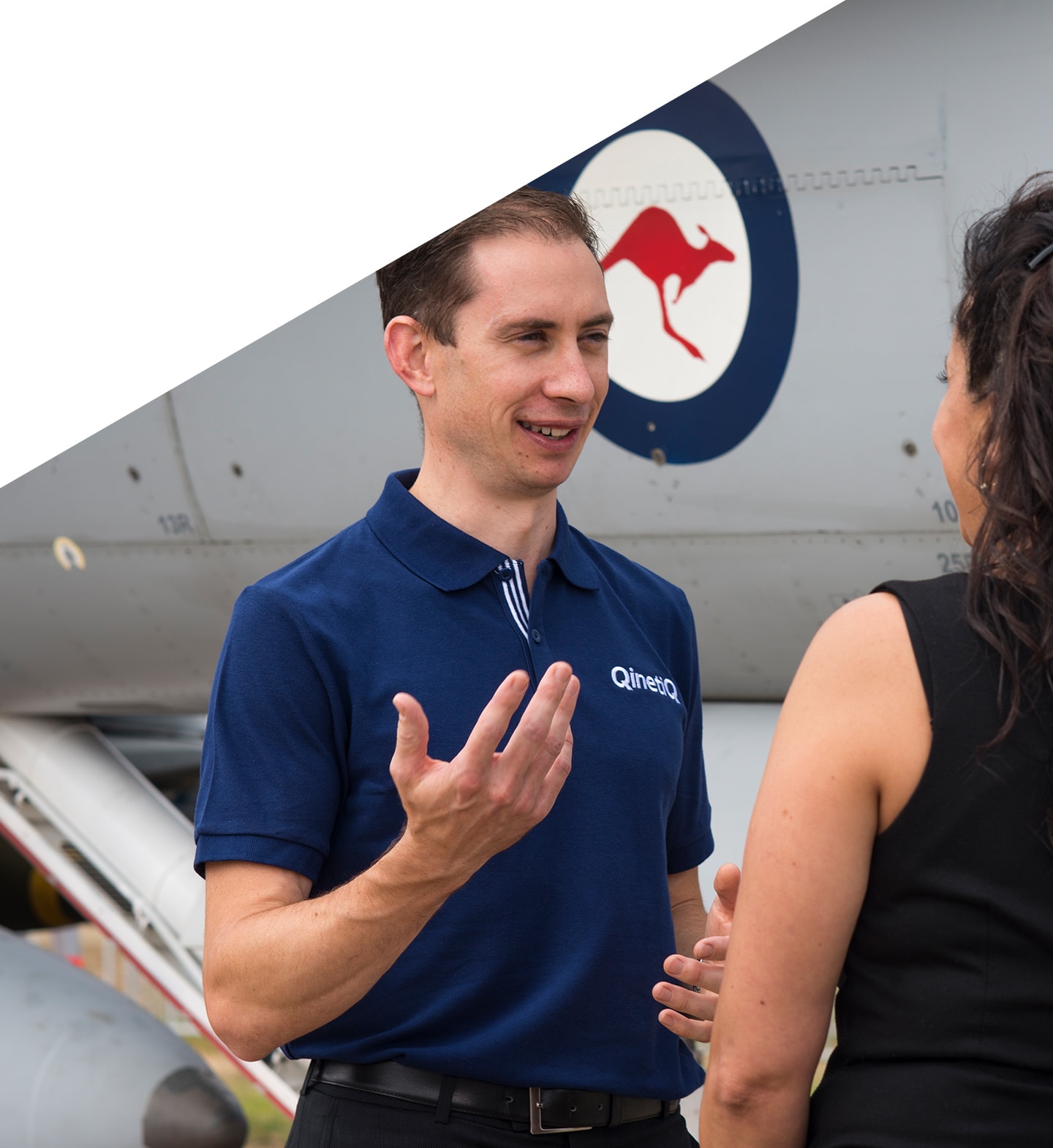 Qinetiq staff talking to woman